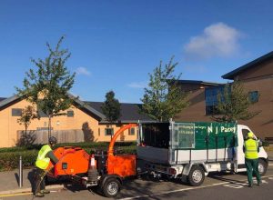 NJ Pacey Work Van nj pacey van standing by a building with a wood shredder